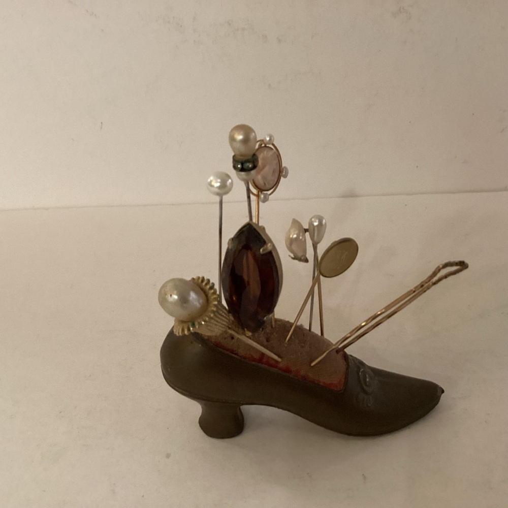 Antique brass shoe pin cushion witch 9 hat pins.